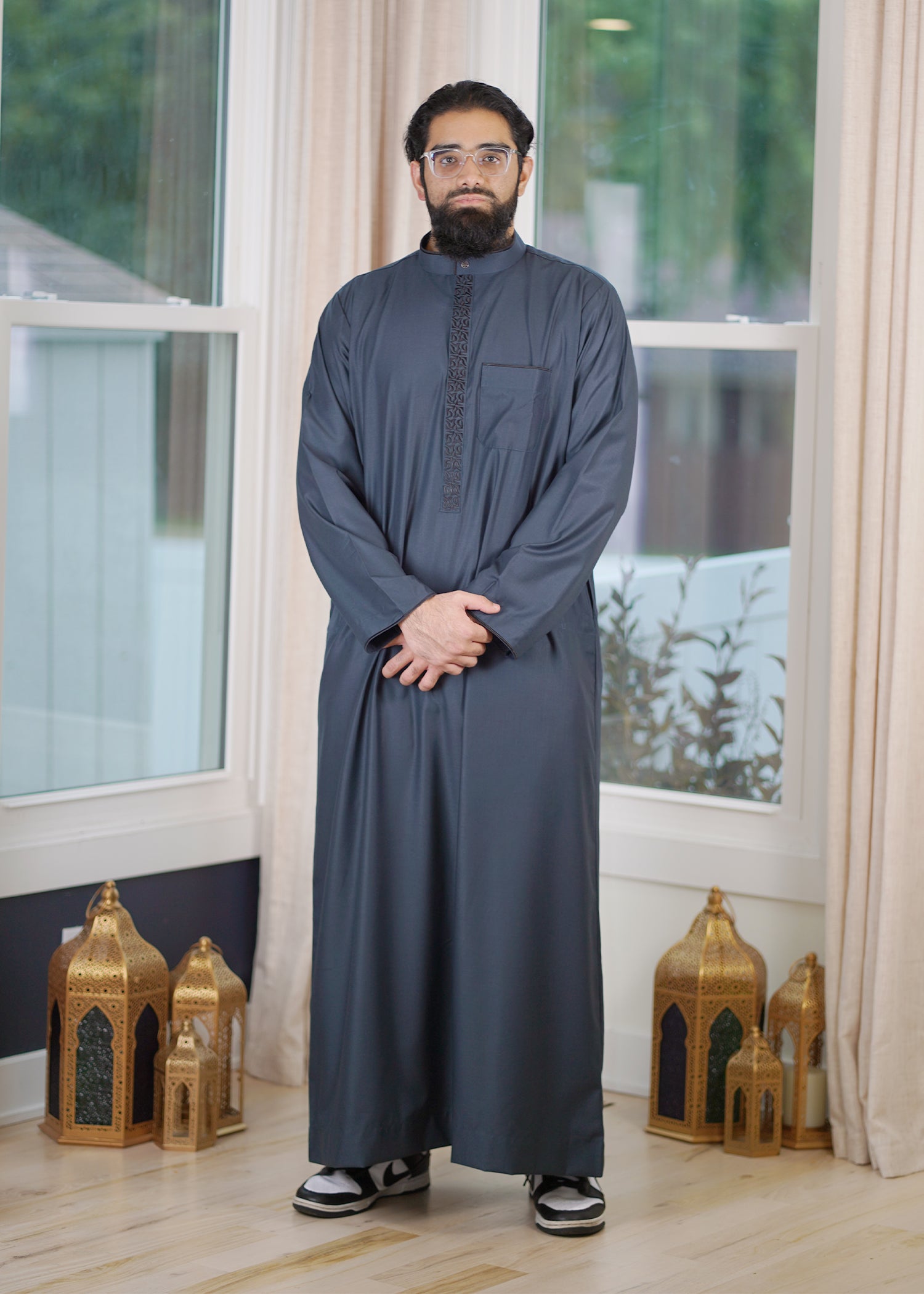 Front view of the Slate Blue Embroidered Thobe showing the cool steel color and intricate placket


