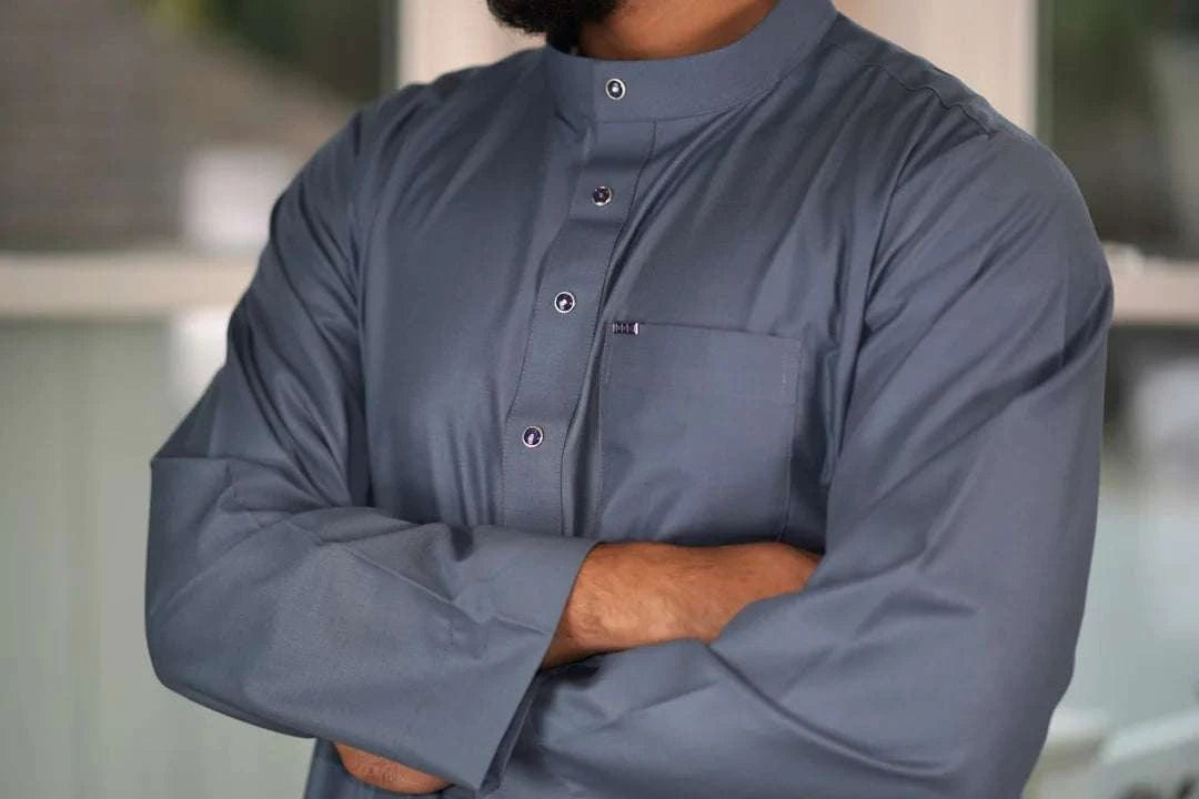 Slate blue thobe with everyday mandarin collar for men, worn by a model outdoors