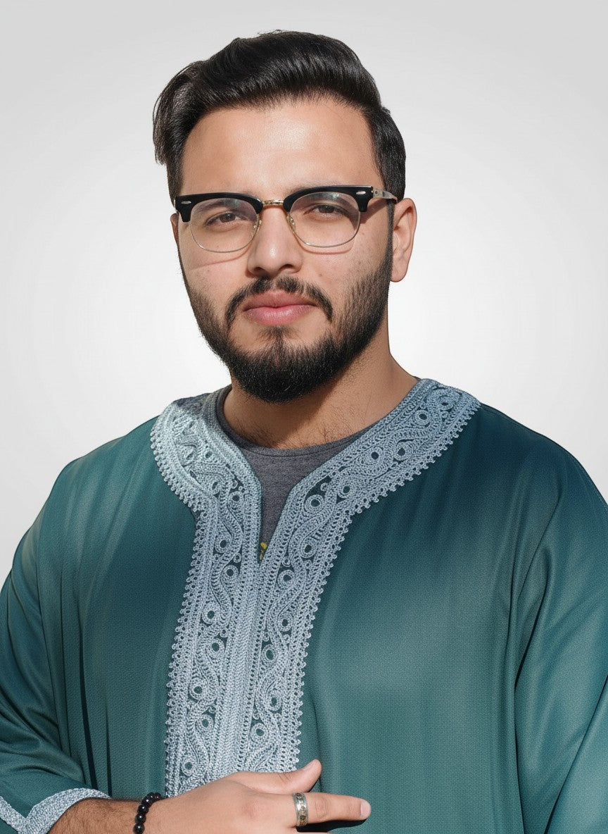 The Topi Wala men's forest green Moroccan thobe with intricate light blue embroidery on the neckline and placket. Lightweight, breathable fabric.