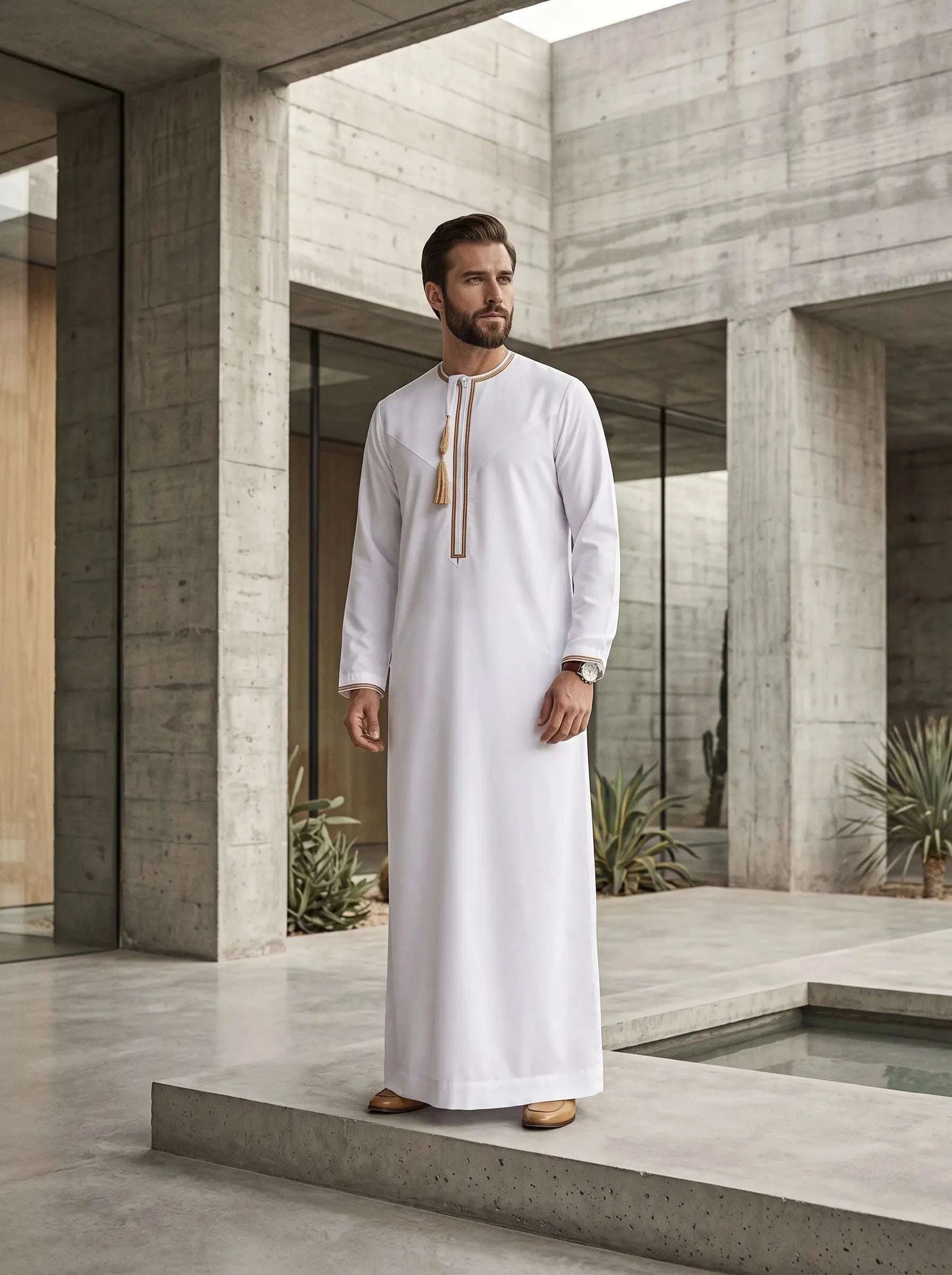White Emirati thobe for men, close-up of the embroidered detailing