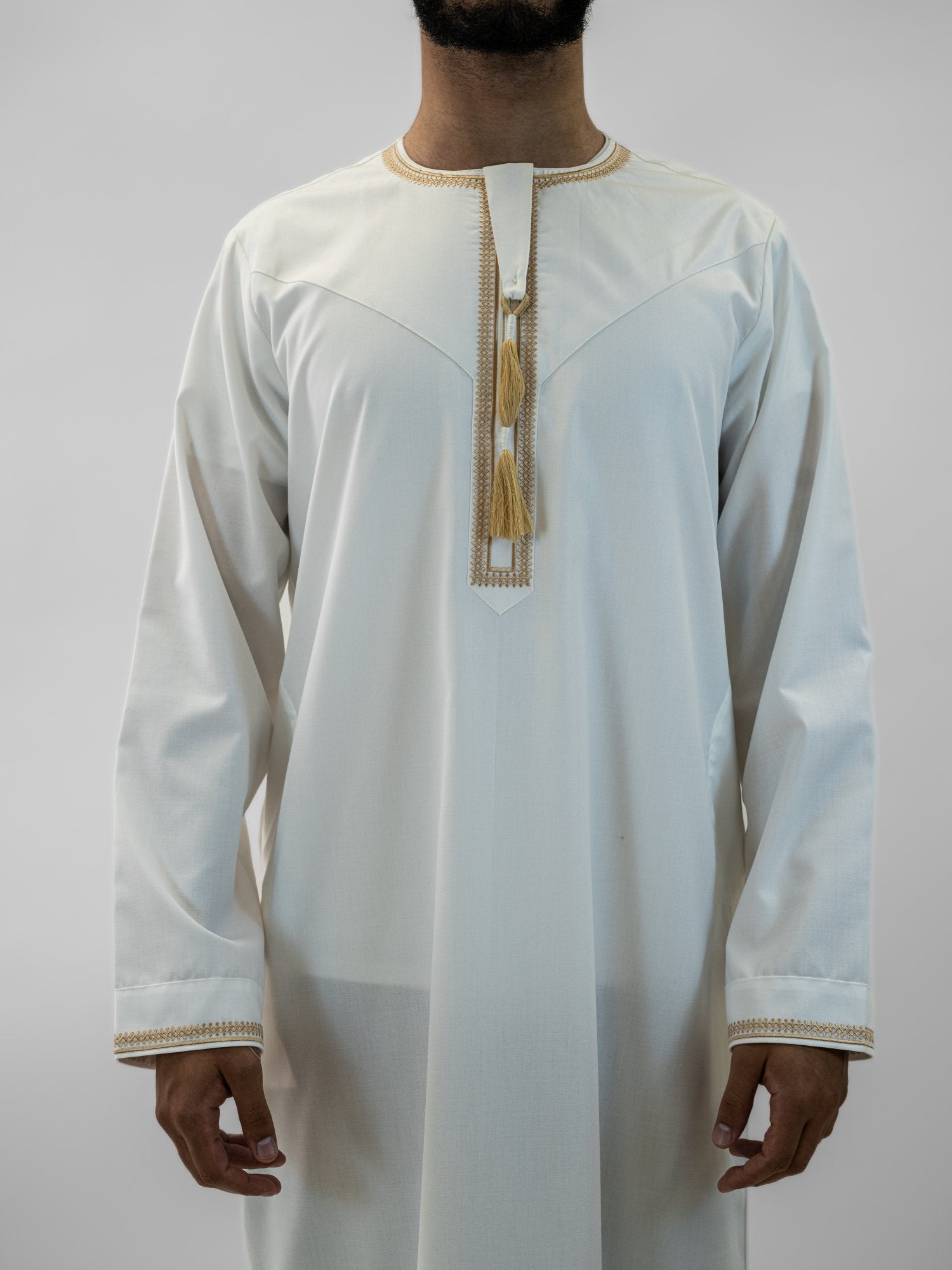 White emirati with tarboush cap thobe for men, close-up of the fabric